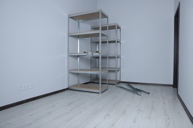 Office room with white walls and metal storage shelves