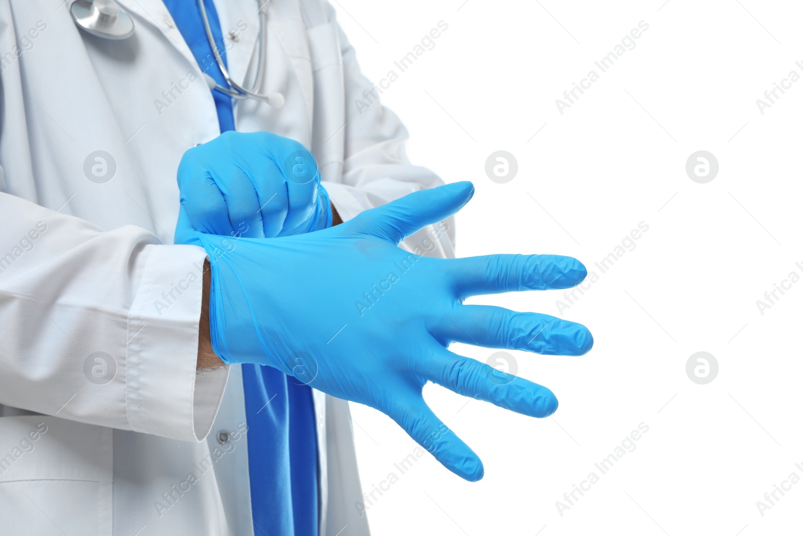Photo of Doctor putting on medical gloves against white background, closeup