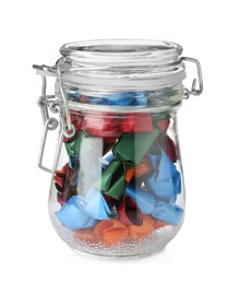 Glass jar with candies in colorful wrappers isolated on white