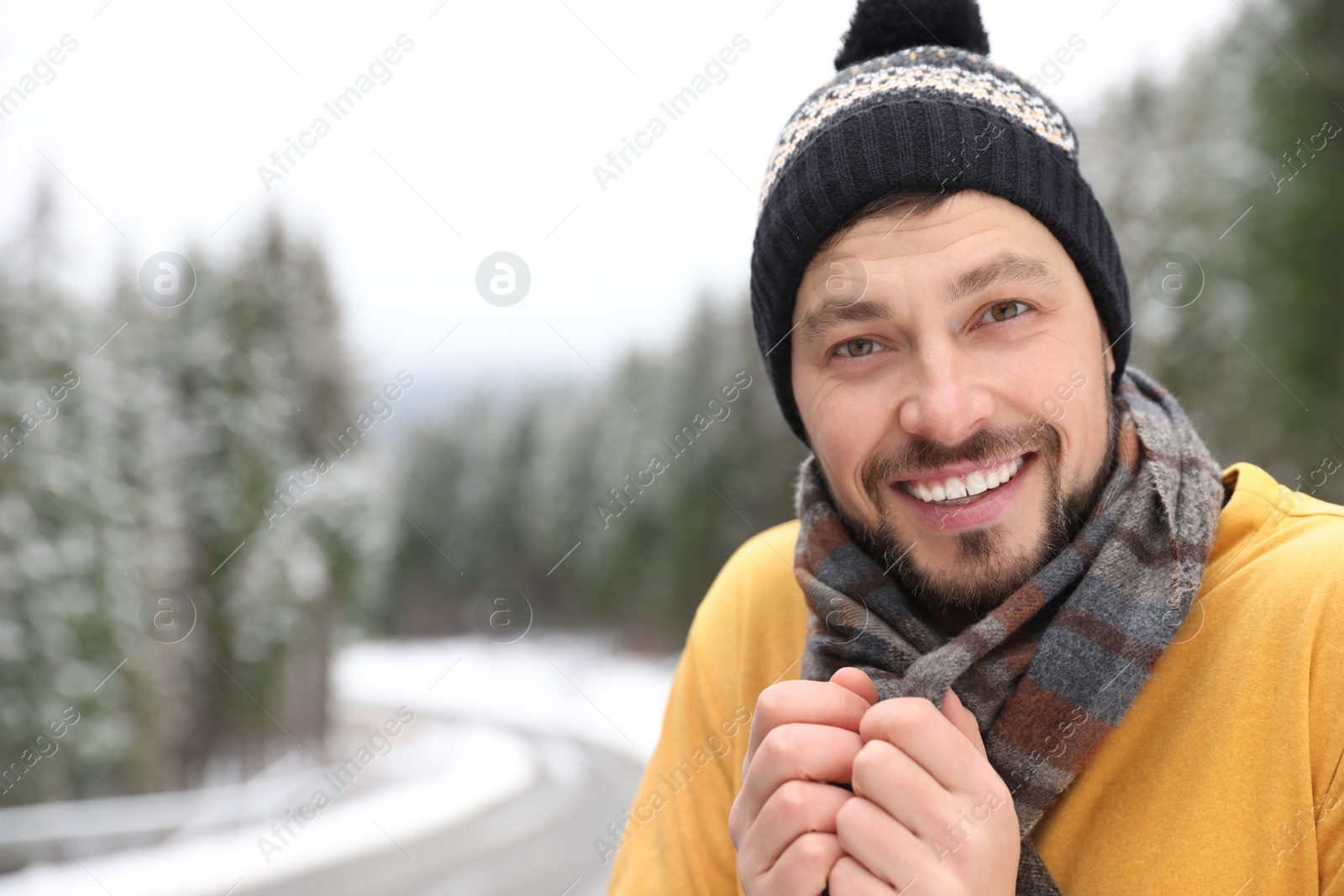 Photo of Man in warm clothes outdoors, space for text. Winter vacation