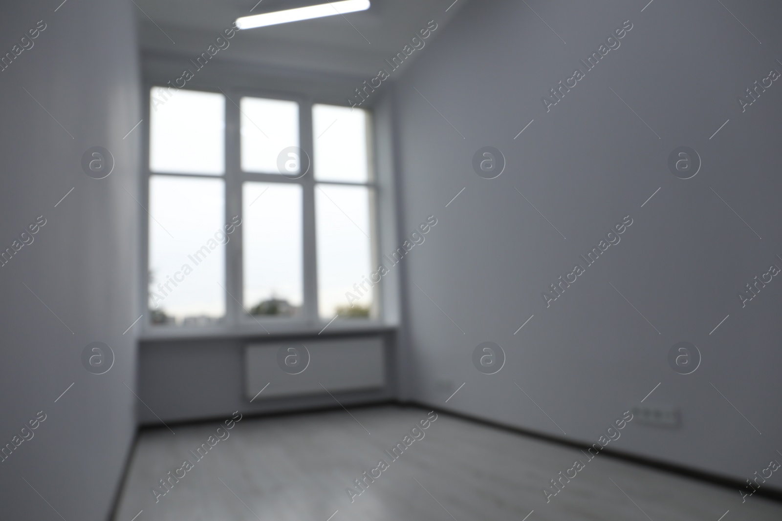 Photo of Blurred view of window in empty renovated room