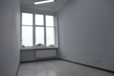 Photo of Blurred view of window in empty renovated room