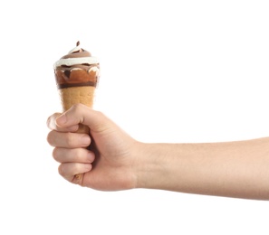 Man holding yummy ice cream on white background. Focus on hand