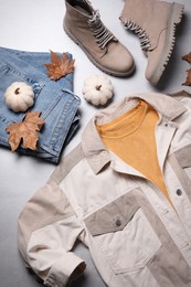 Photo of Fall fashion. Layout of women's outfit on light grey background, top view