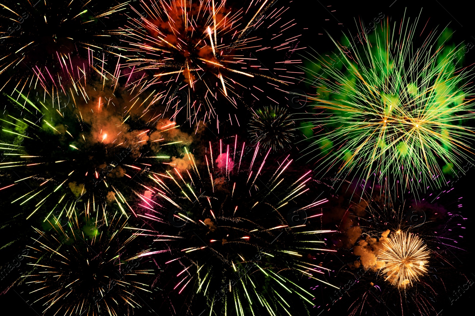 Image of Beautiful bright fireworks lighting up night sky