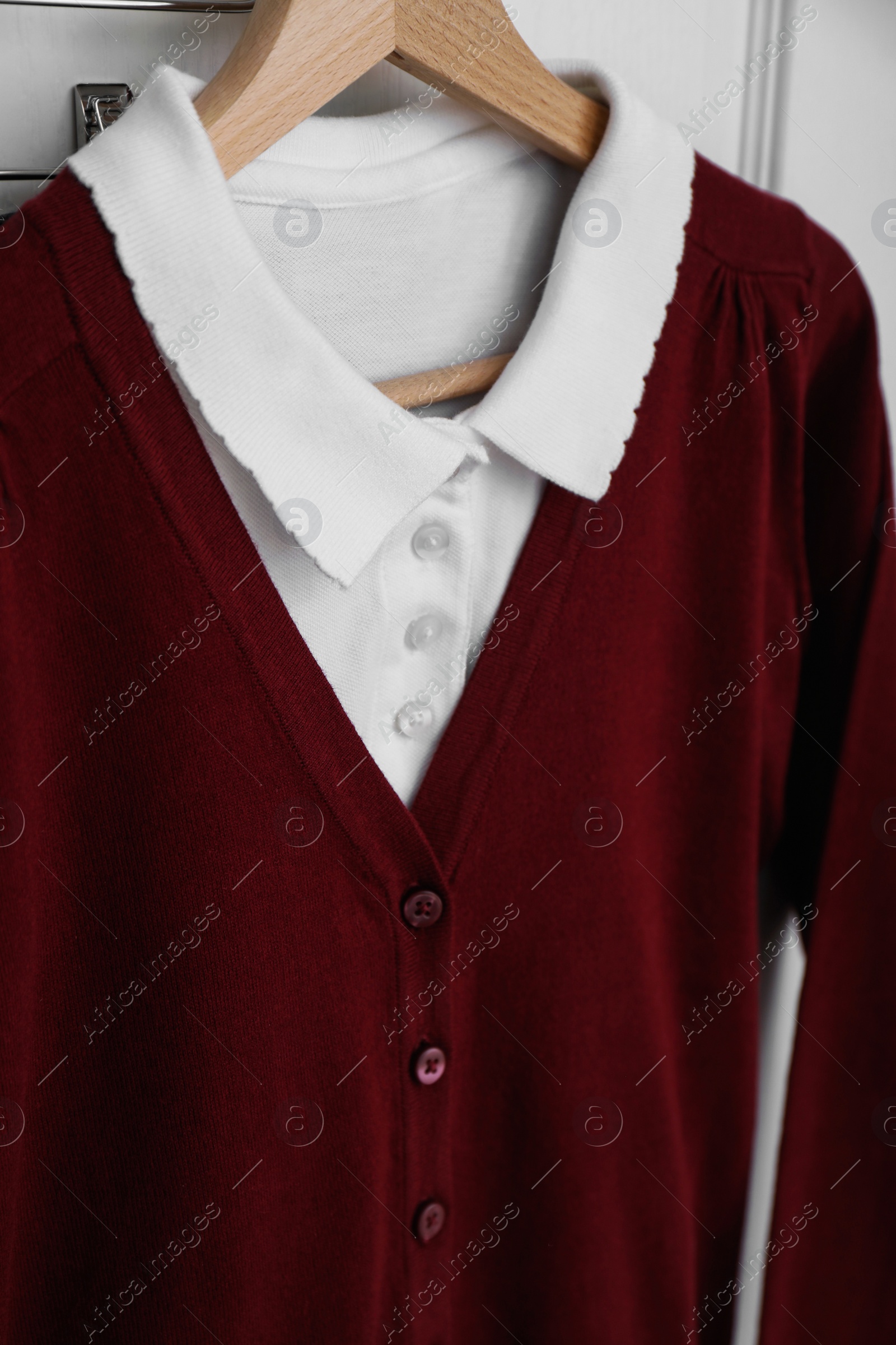 Photo of School uniform for girl on hanger, closeup