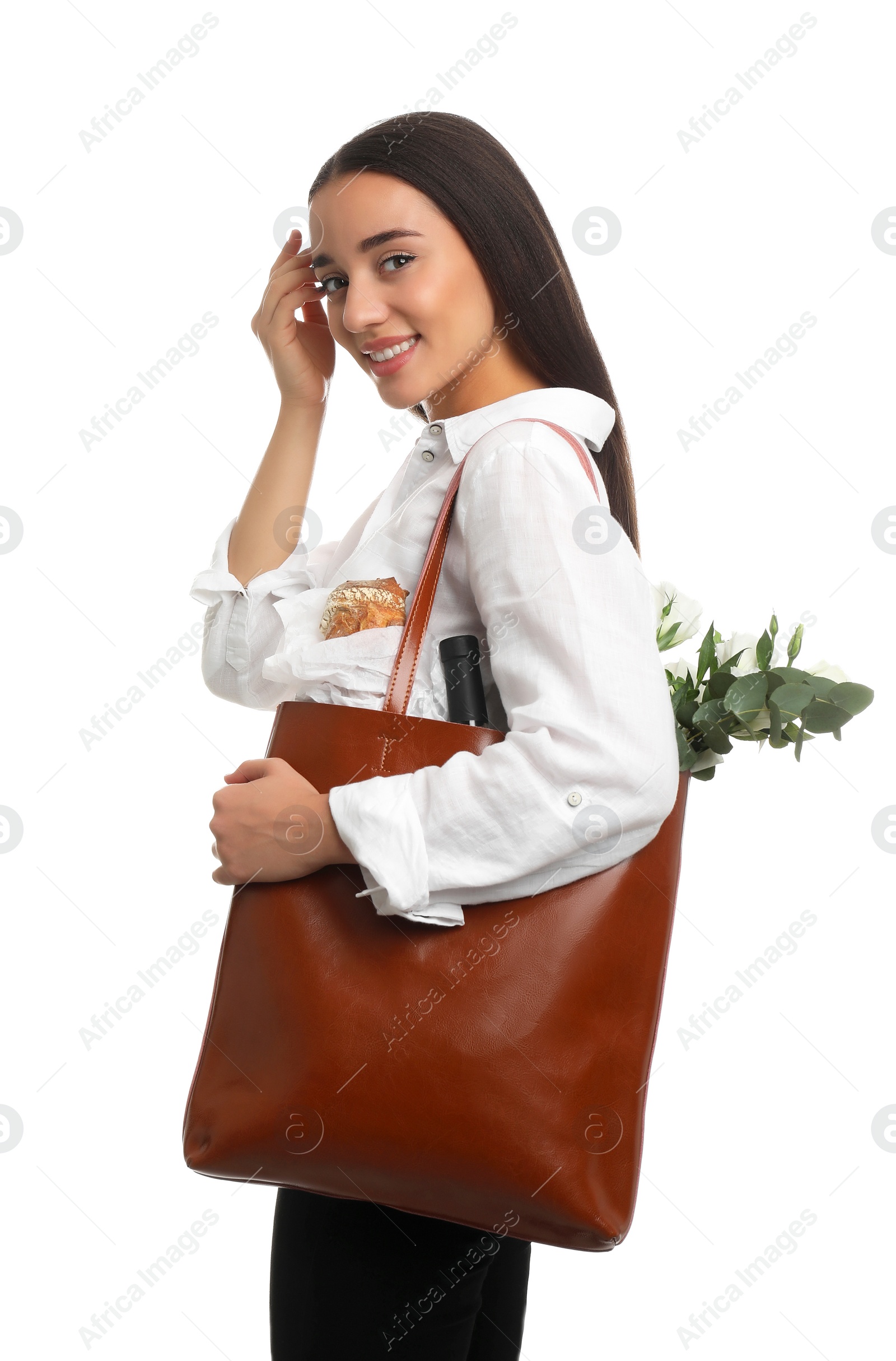 Photo of Young woman with leather shopper bag on white background