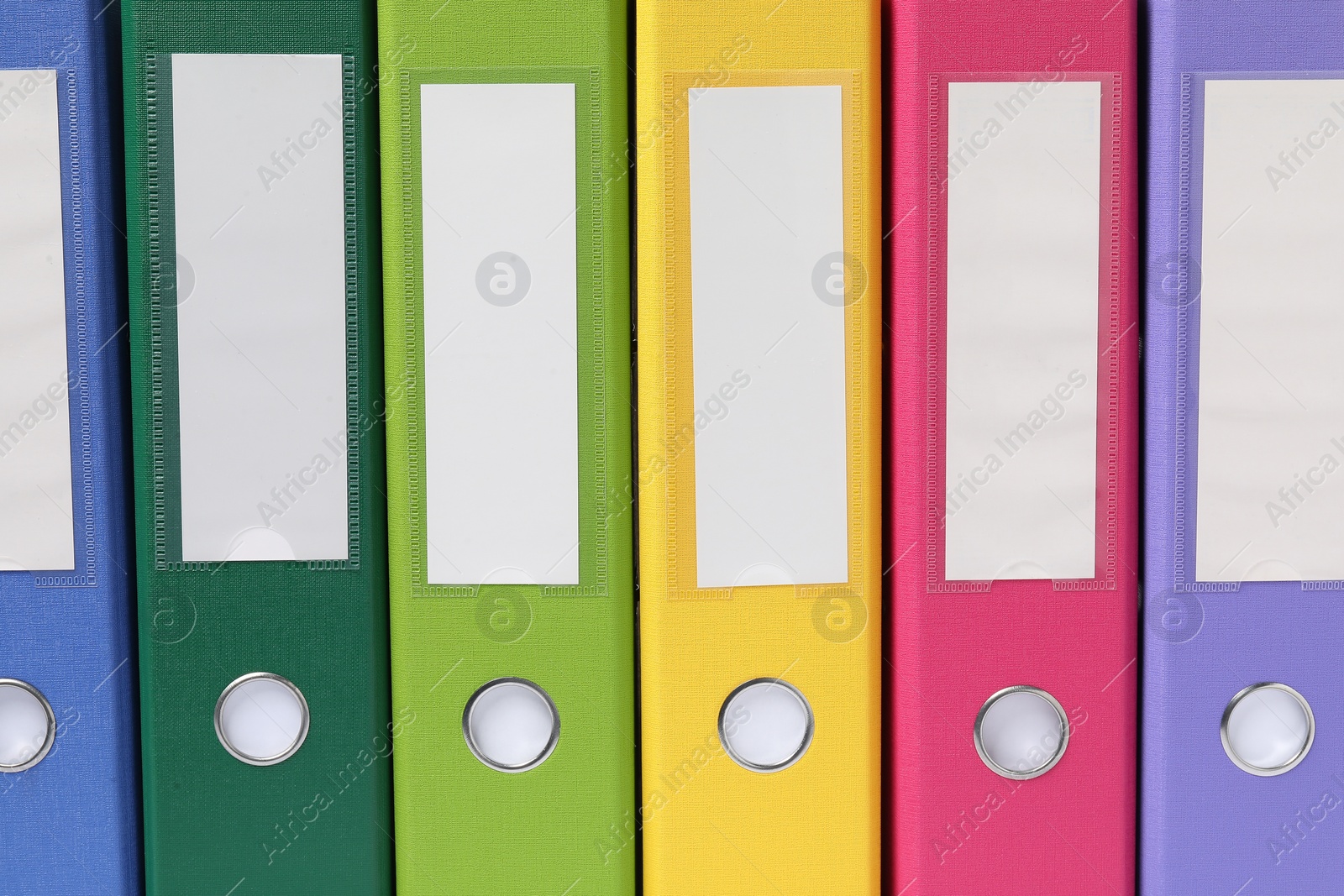 Photo of Bright binder office folders as background, closeup