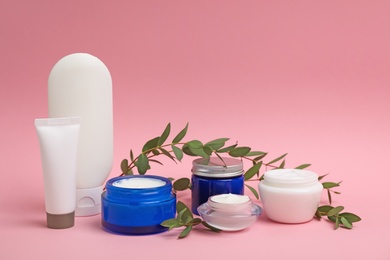 Photo of Composition with cosmetic products on color background