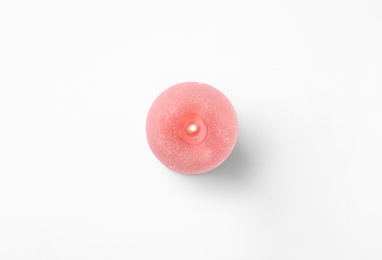 Photo of Pink candle isolated on white, top view