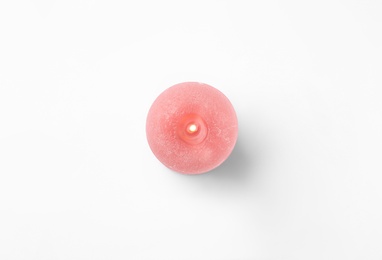 Pink candle isolated on white, top view