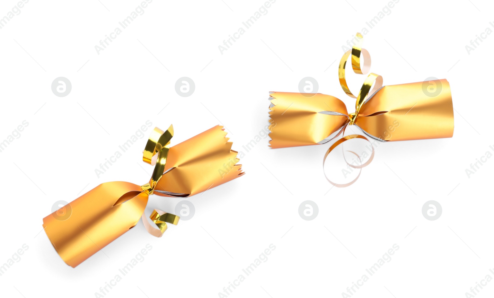 Photo of Open shiny golden Christmas cracker isolated on white, top view