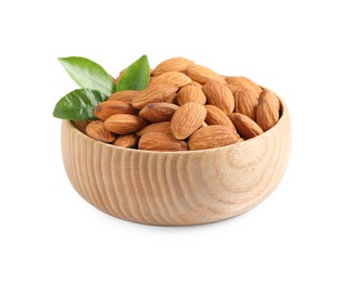 Wooden bowl with organic almond nuts and green leaves on white background. Healthy snack