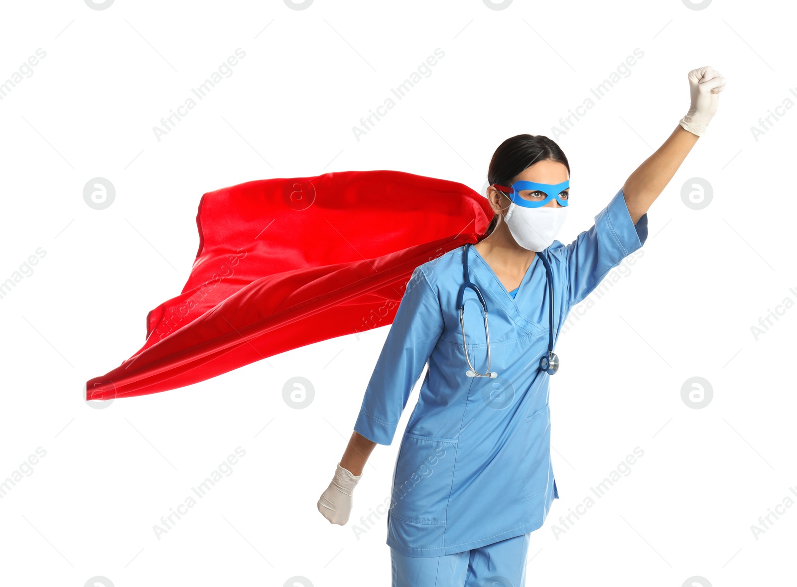 Photo of Doctor dressed as superhero posing on white background. Concept of medical workers fighting with COVID-19