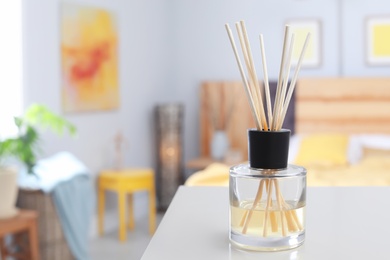 Reed freshener on table in bedroom