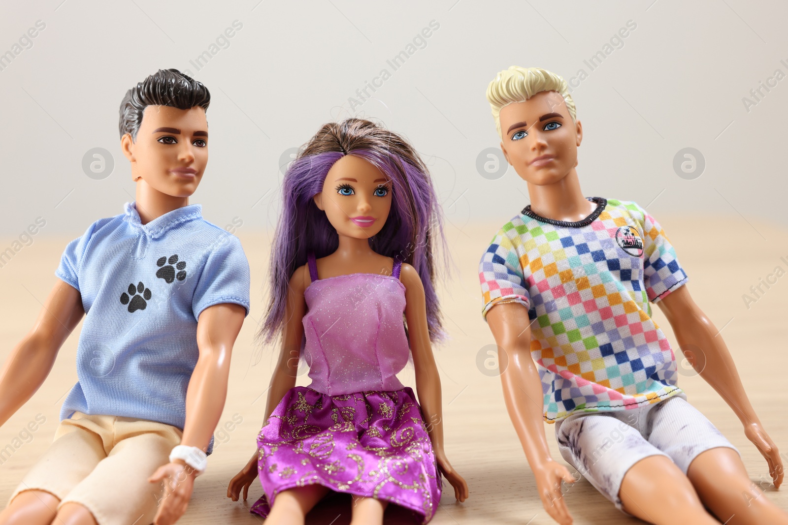 Photo of Leiden, Netherlands - September 20, 2023: Stylish Barbie and Ken dolls on table against light gray background