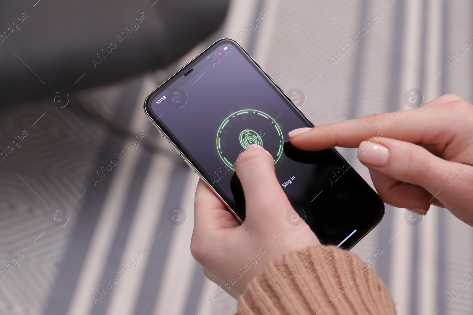 Photo of Woman unlocking smartphone with fingerprint scanner indoors, closeup. Reliable password