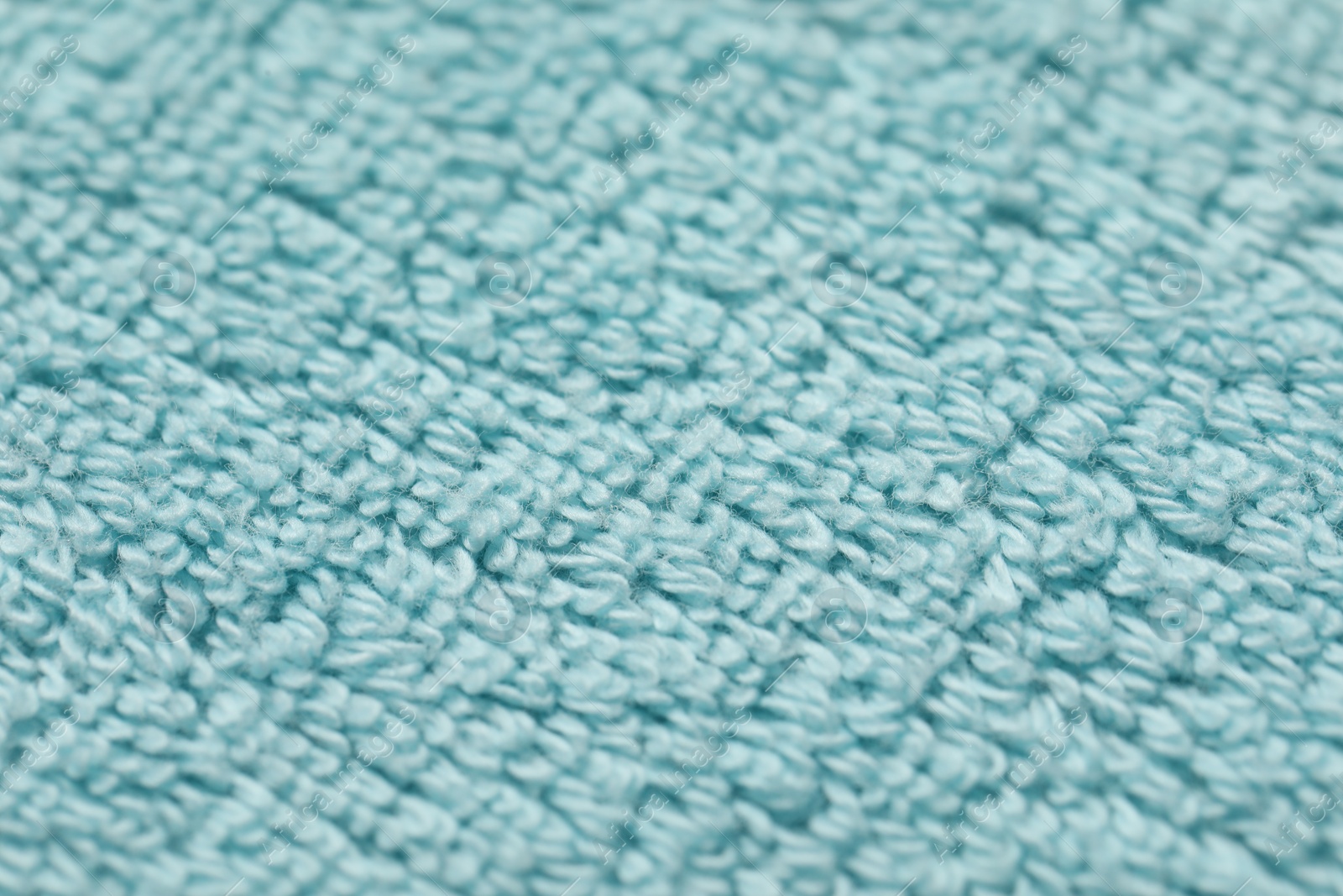 Photo of Texture of soft light blue fabric as background, closeup