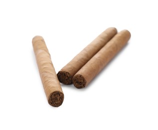 Photo of Cigars wrapped in tobacco leaves on white background