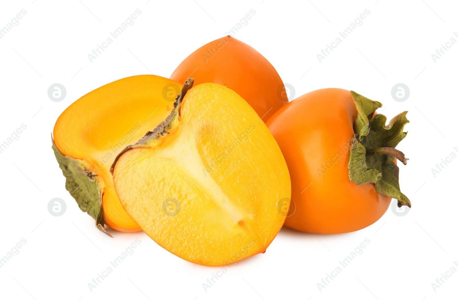 Photo of Whole and cut delicious ripe juicy persimmons on white background