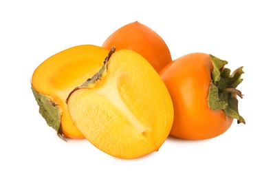 Photo of Whole and cut delicious ripe juicy persimmons on white background