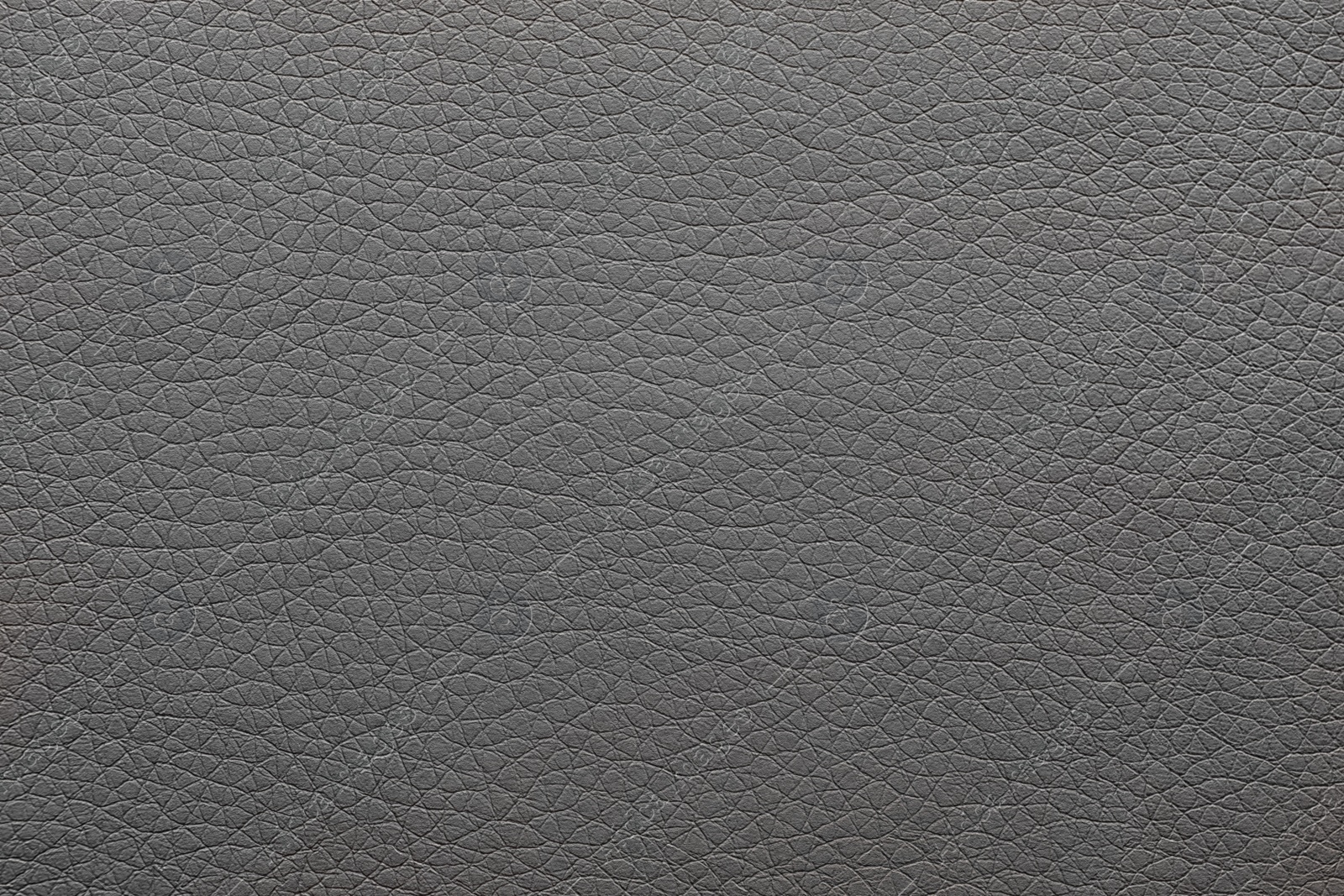 Photo of Texture of dark leather as background, closeup