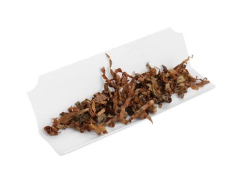 Photo of Making hand rolled cigarette. Paper with tobacco isolated on white.