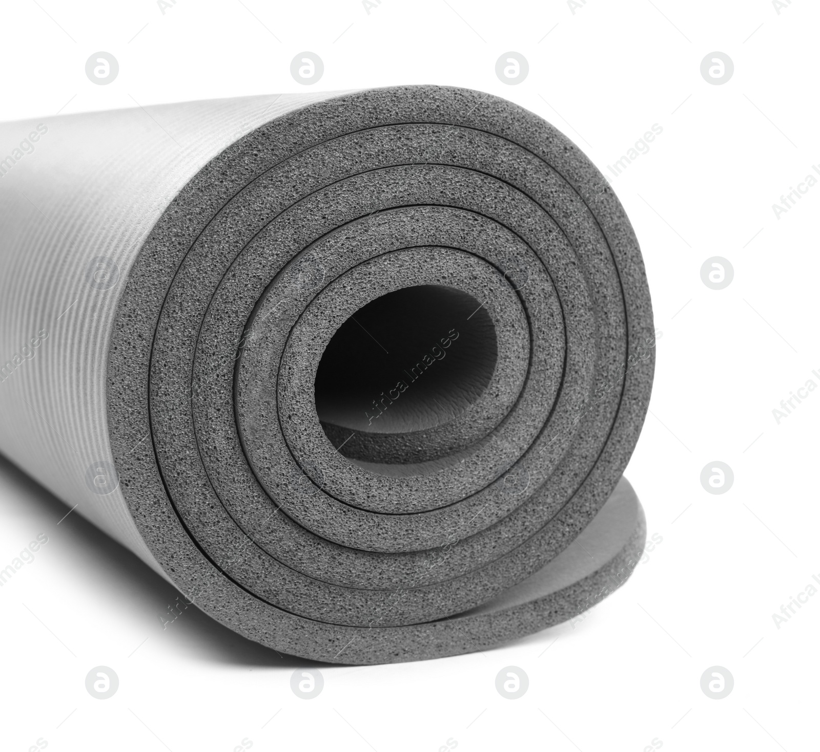 Photo of Rolled grey yoga mat on white background