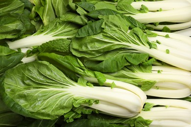 Photo of Fresh green pak choy cabbages as background, top view