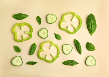 Photo of Flat lay composition with fresh ingredients for salad on beige background