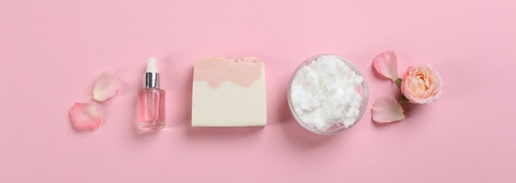 Photo of Flat lay composition with natural handmade soap and ingredients on pink background