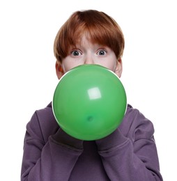 Photo of Boy inflating green balloon on white background