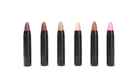 Photo of Set of colorful lipsticks isolated on white