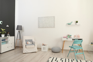 Photo of Modern child room interior with stylish furniture