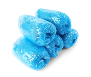 Photo of Medical blue shoe covers on white background