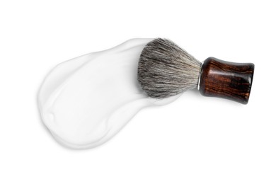 Photo of Shaving brush and foam on white background, top view