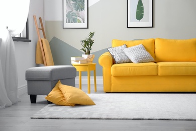 Photo of Stylish living room interior with comfortable sofa