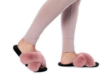 Photo of Woman in soft slippers on white background, closeup