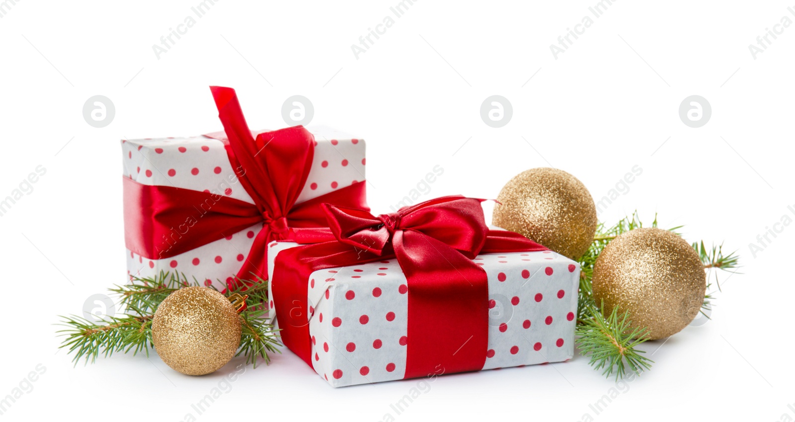 Photo of Composition with Christmas tree branches, festive decor and gift boxes on white background