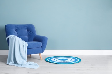 Photo of Elegant room interior with stylish comfortable armchair