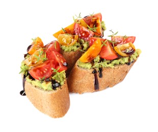 Photo of Delicious bruschettas with avocado, tomatoes and balsamic vinegar isolated on white