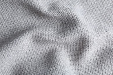 Photo of Texture of beautiful light fabric as background, closeup