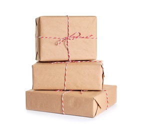 Photo of Beautifully wrapped gift boxes on white background