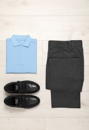 Photo of School uniform for boy on laminate, top view