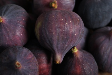 Tasty fresh figs as background, closeup view