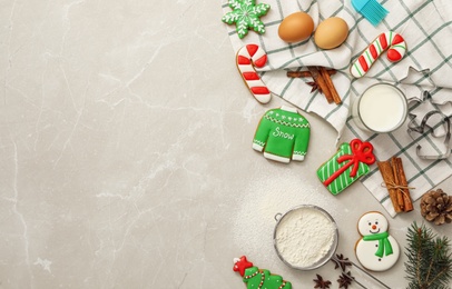 Photo of Flat lay composition with delicious homemade Christmas cookies on grey marble table. Space for text