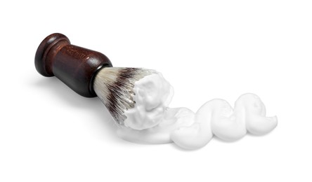 Shaving foam and brush on white background