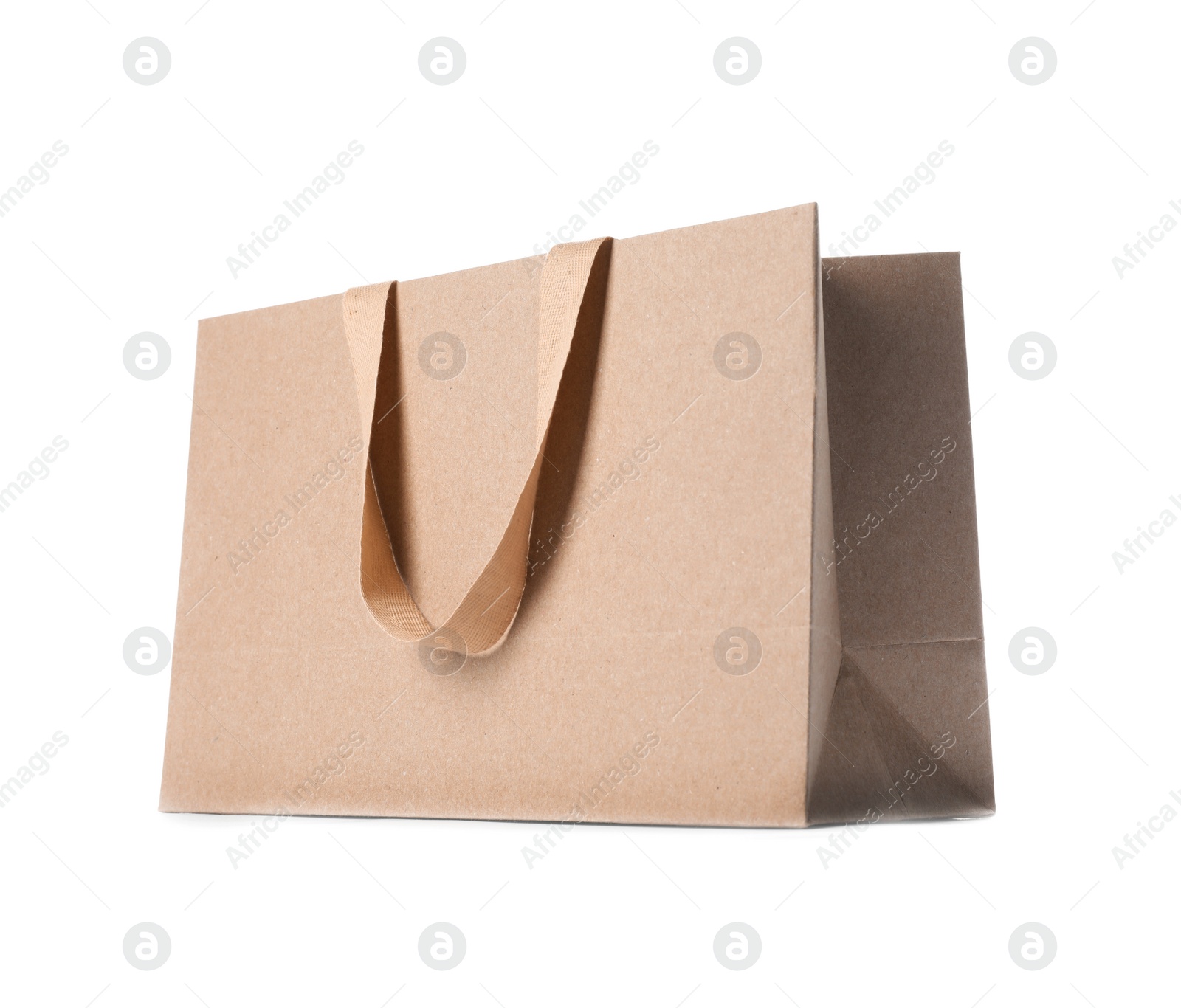 Photo of Paper shopping bag with comfortable handles on white background. Mockup for design