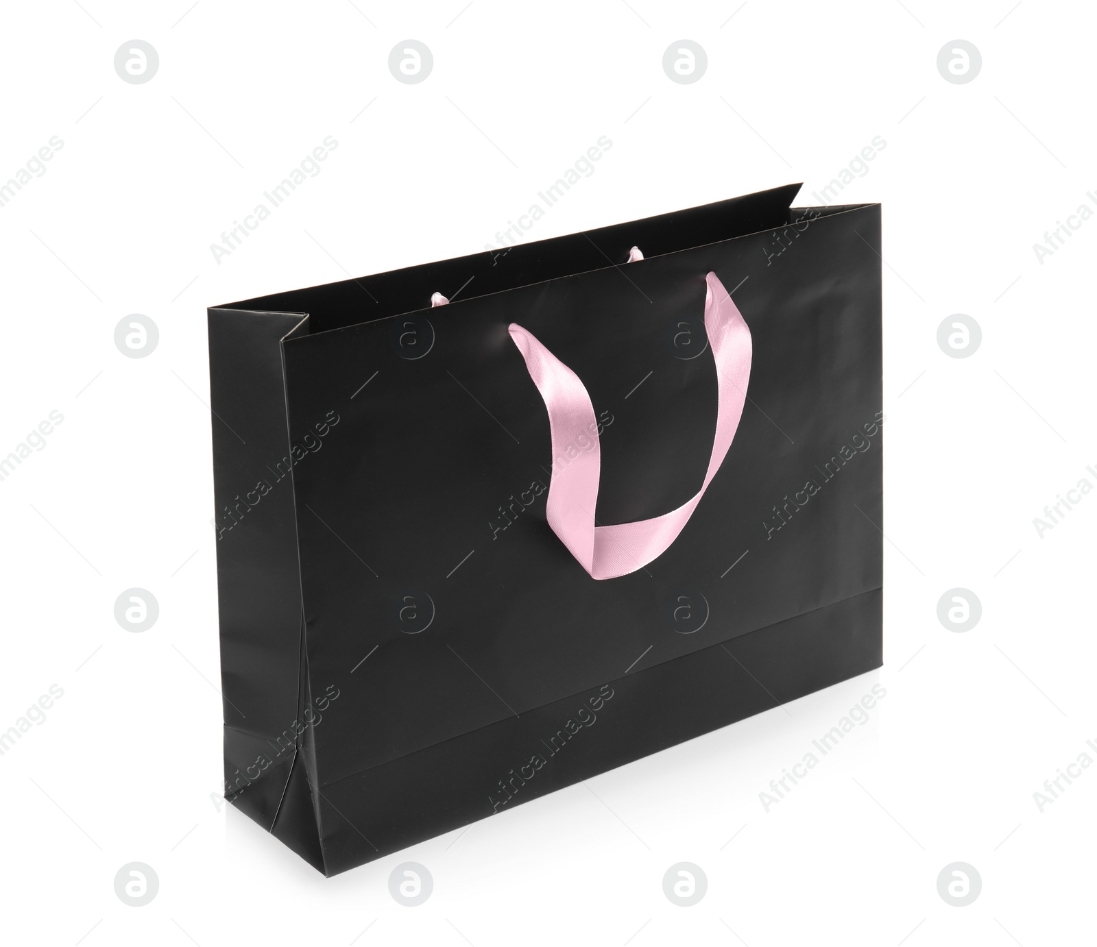 Photo of Paper shopping bag isolated on white. Mock up for design