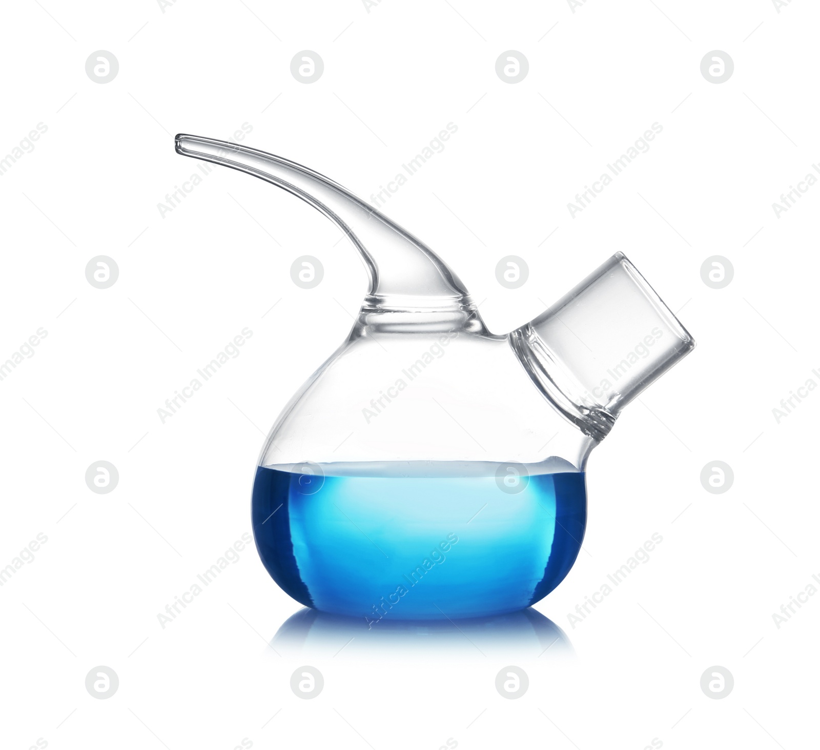 Photo of Retort flask with blue liquid on table against white background. Laboratory analysis